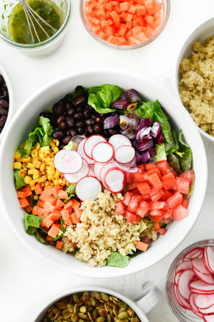 add salad ingredients into a bowl