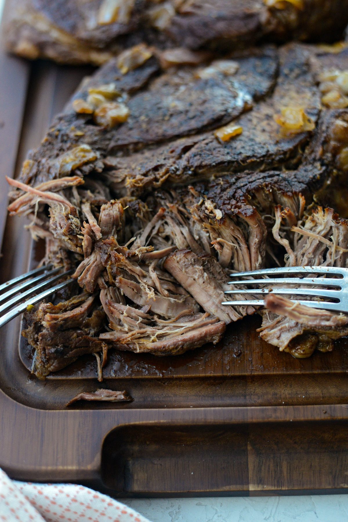 shredding beef with forks