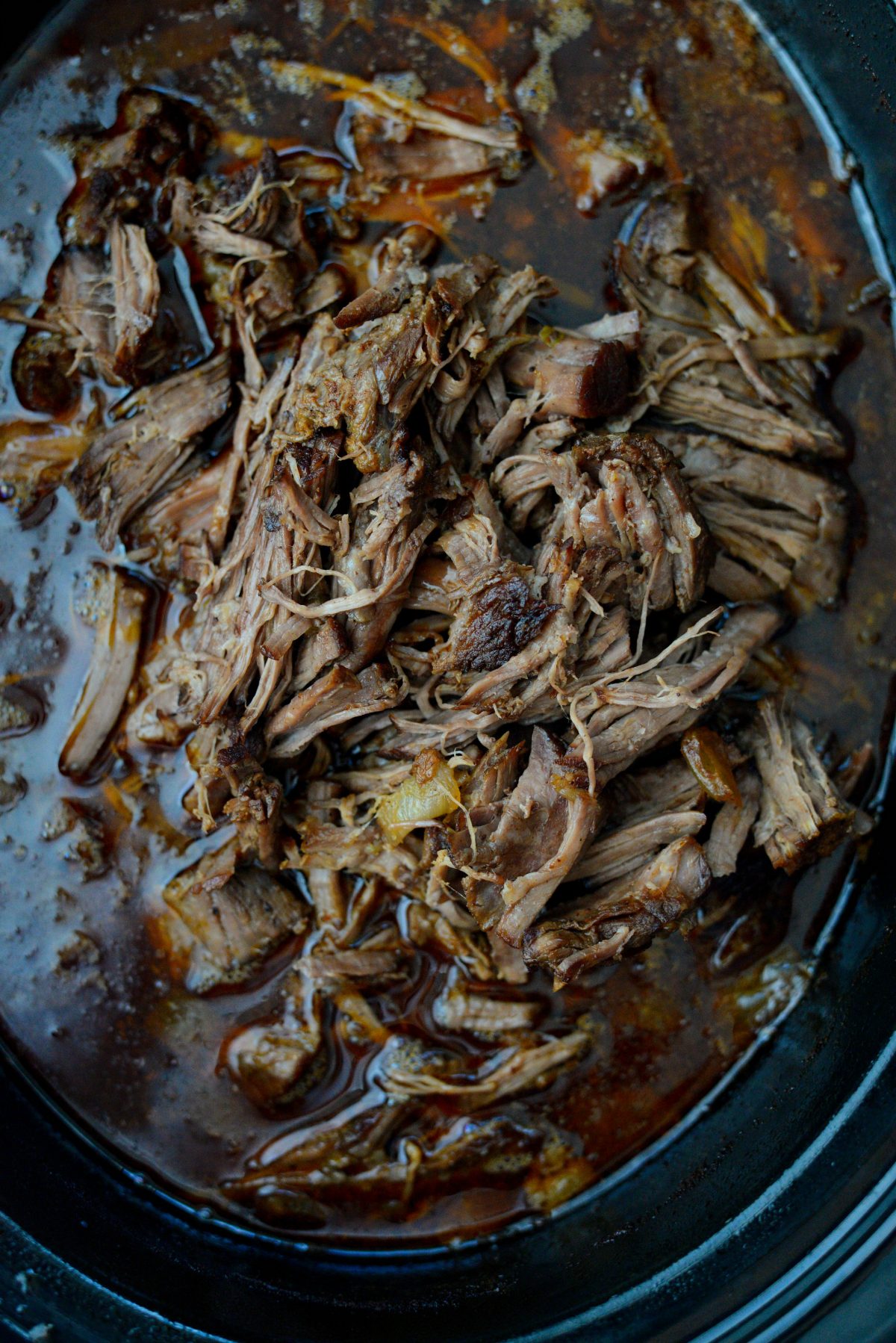 add shredded beef back into slow cooker with liquids