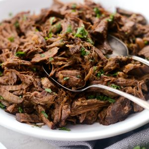 Slow Cooker Beef Barbacoa l SimplyScratch.com #beef #barbacoa #texmex #slowcooker #recipe #easy #shreddedbeef