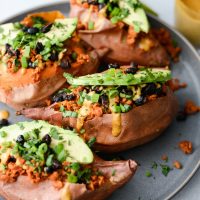 Vegetarian Chorizo Stuffed Sweet Potatoes l SimplyScratch.com #vegetarian #chorizo #sweetpotato #healthy #tahini #roasted #blackbeans #southwest #easy #recipe