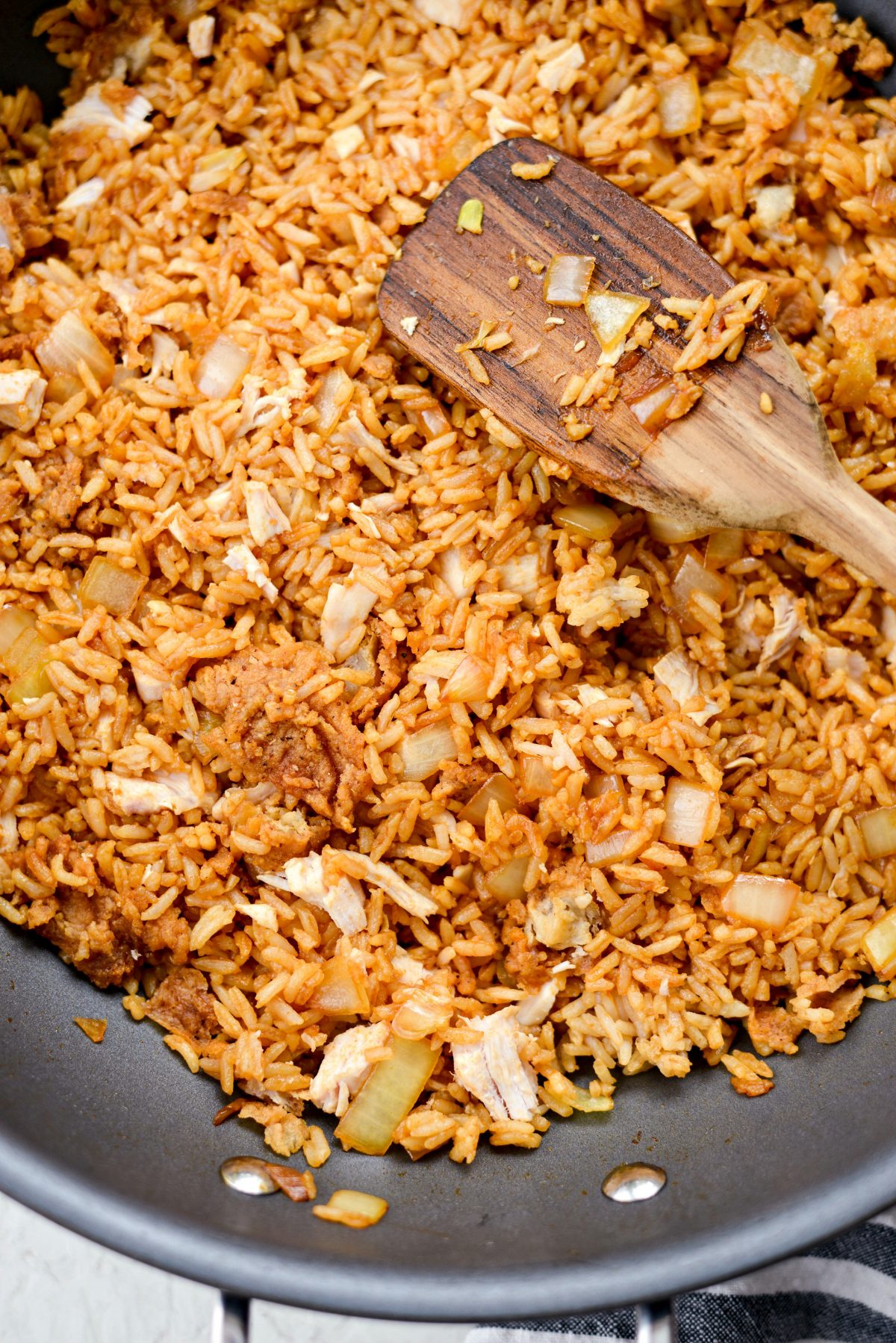 flatten and press the fried rice into the pan.