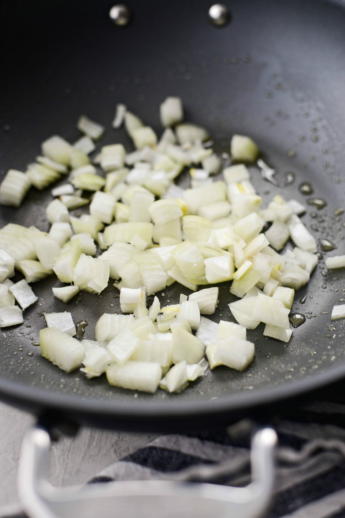add onions to wok with oil