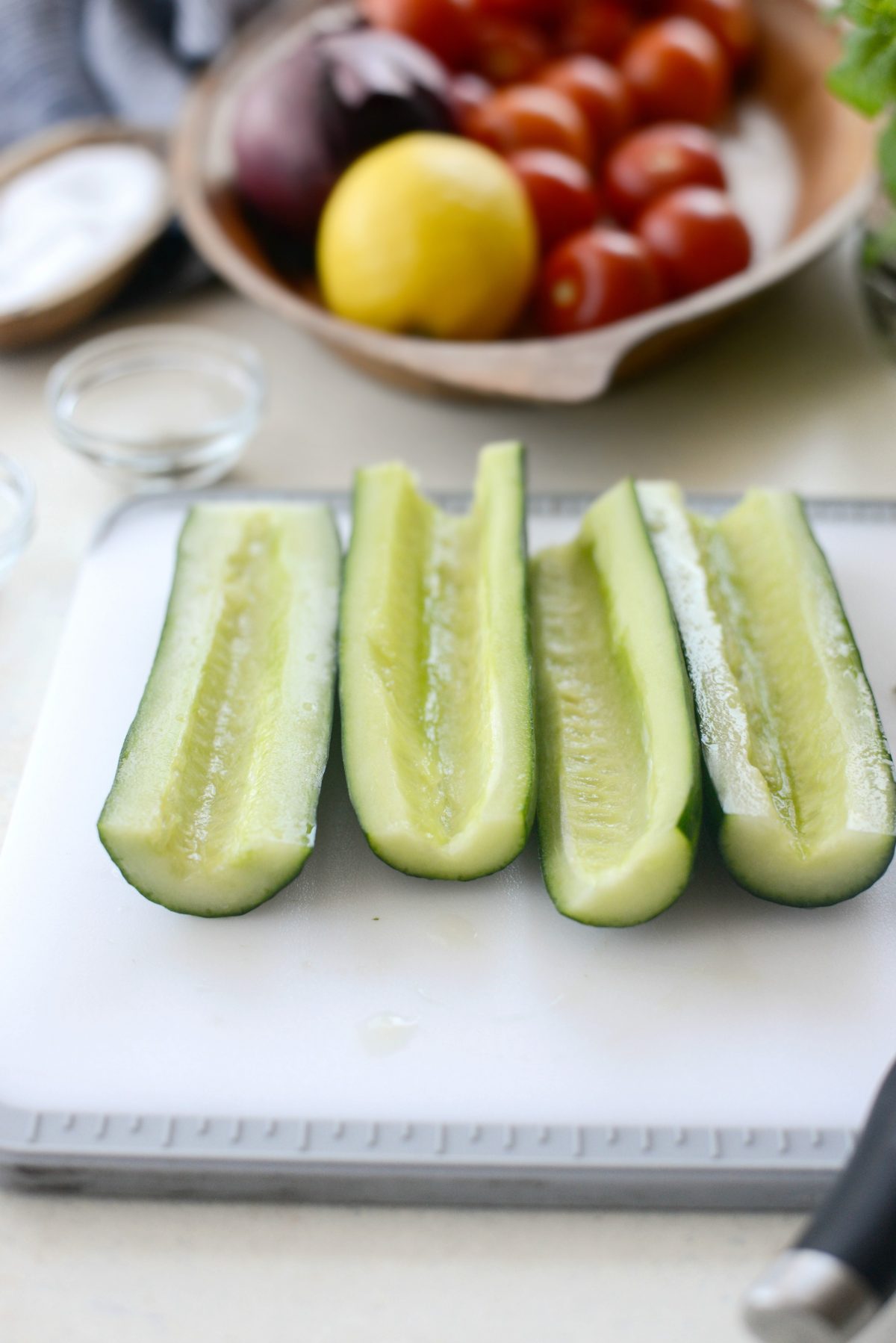 scrape out and discard cucumber seeds.