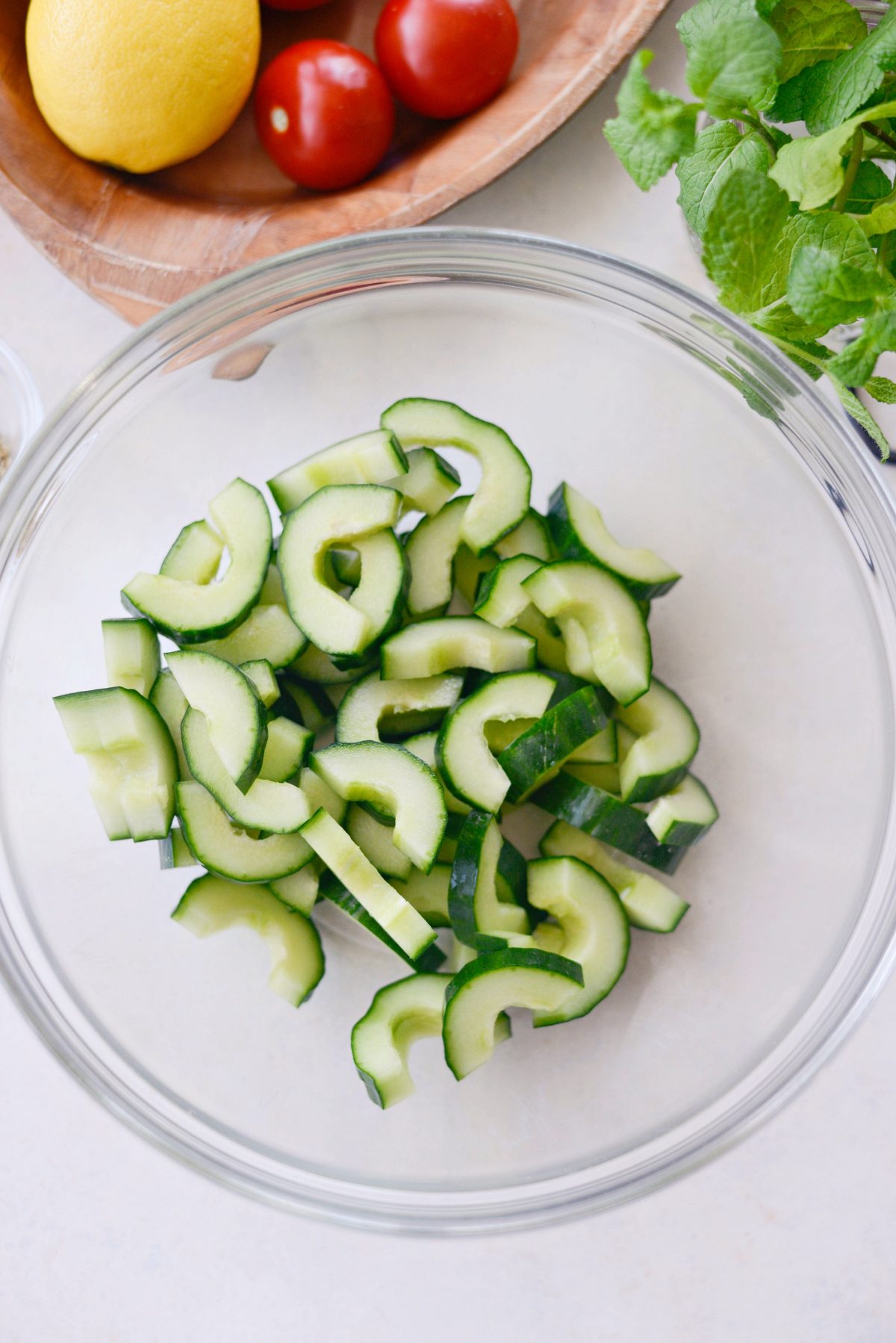 add sliced cucumber into a bowl.