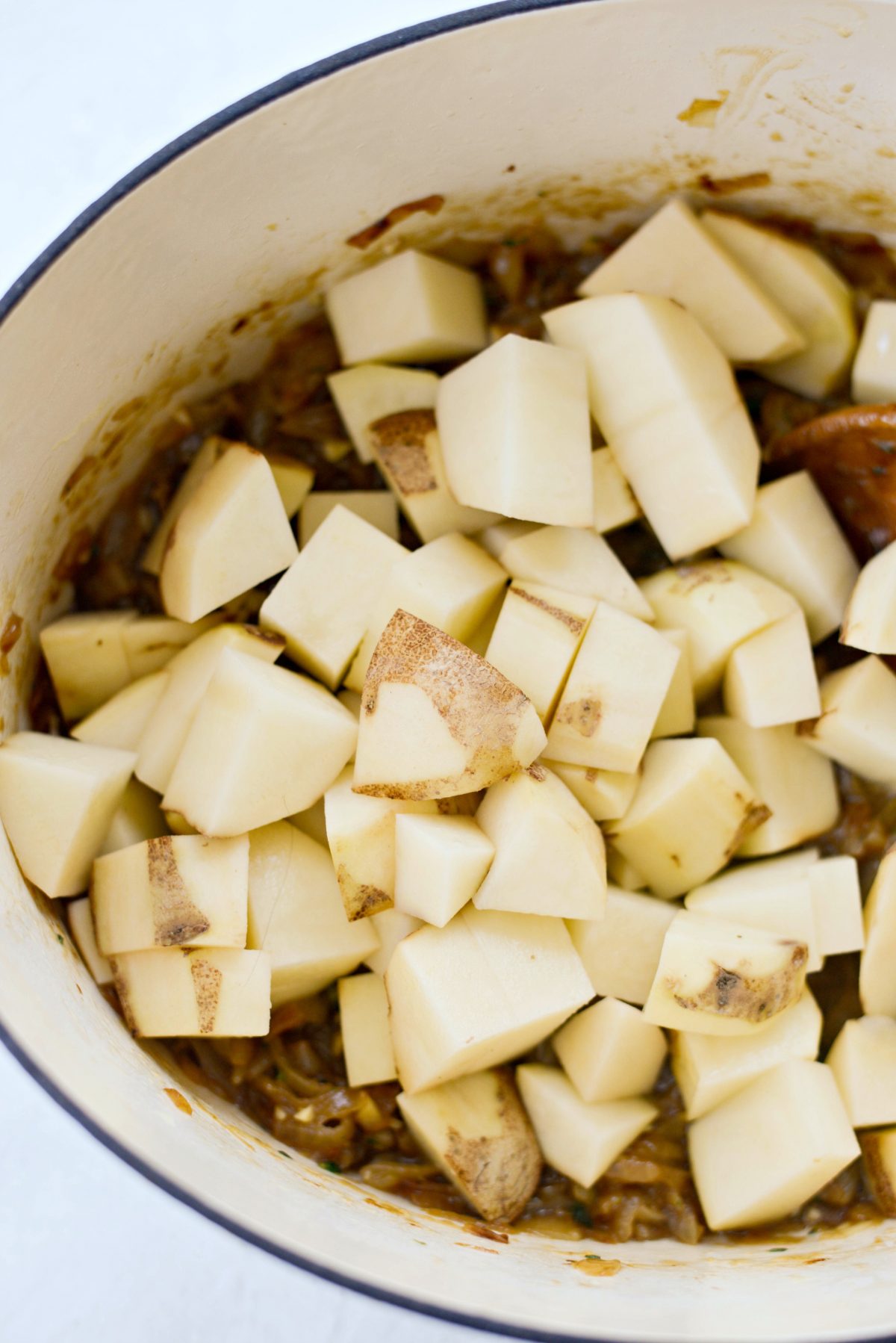 add in roughly peeled russet potatoes