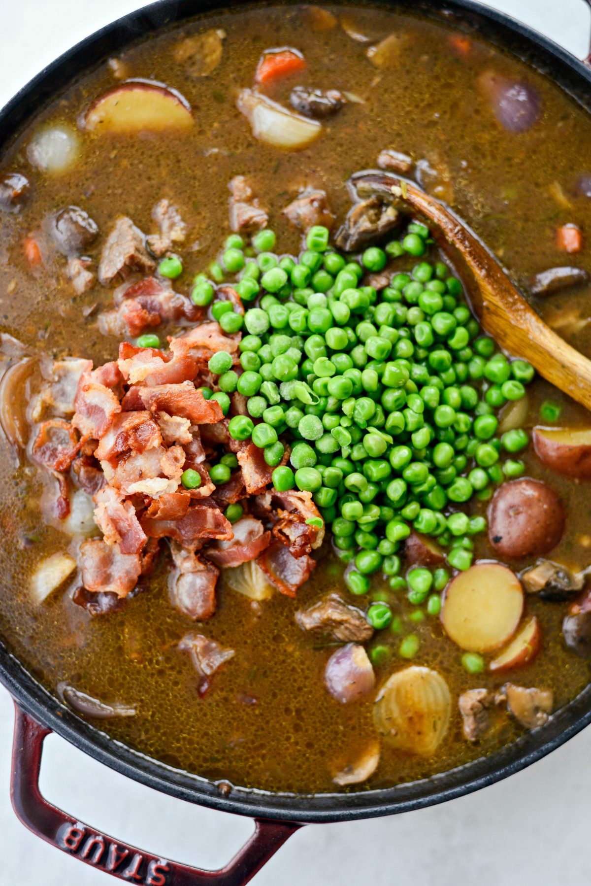 add crispy bacon and peas to the filling