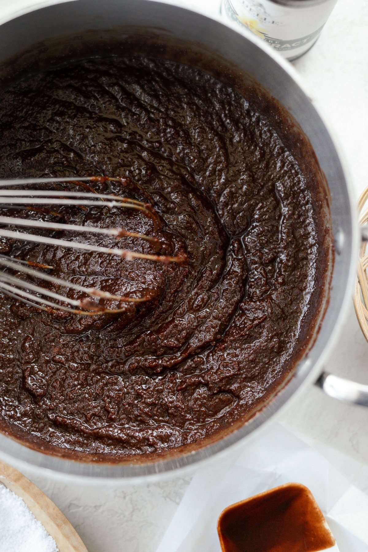 whisking chocolate and sugar