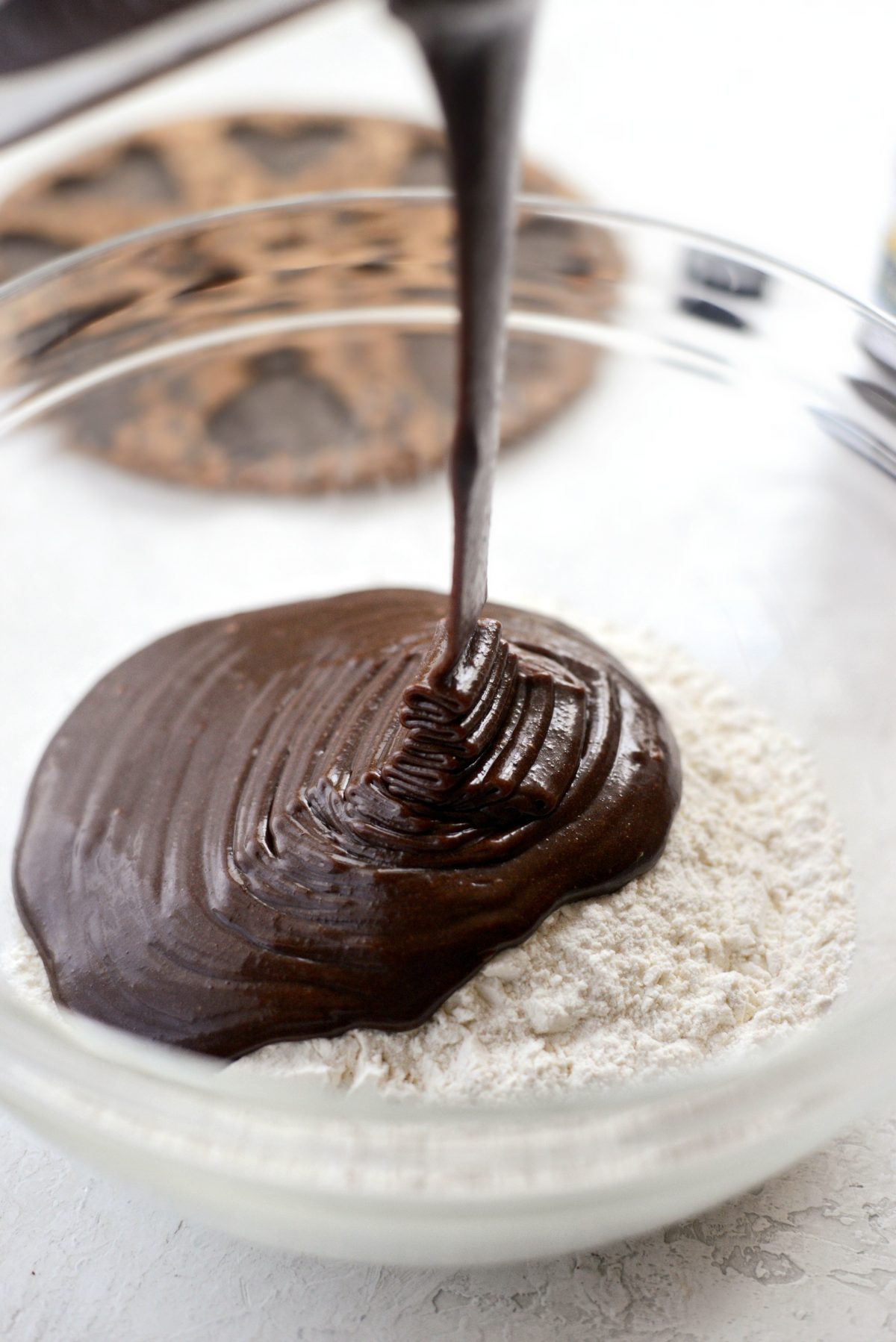 adding chocolate mixture to dry ingredients