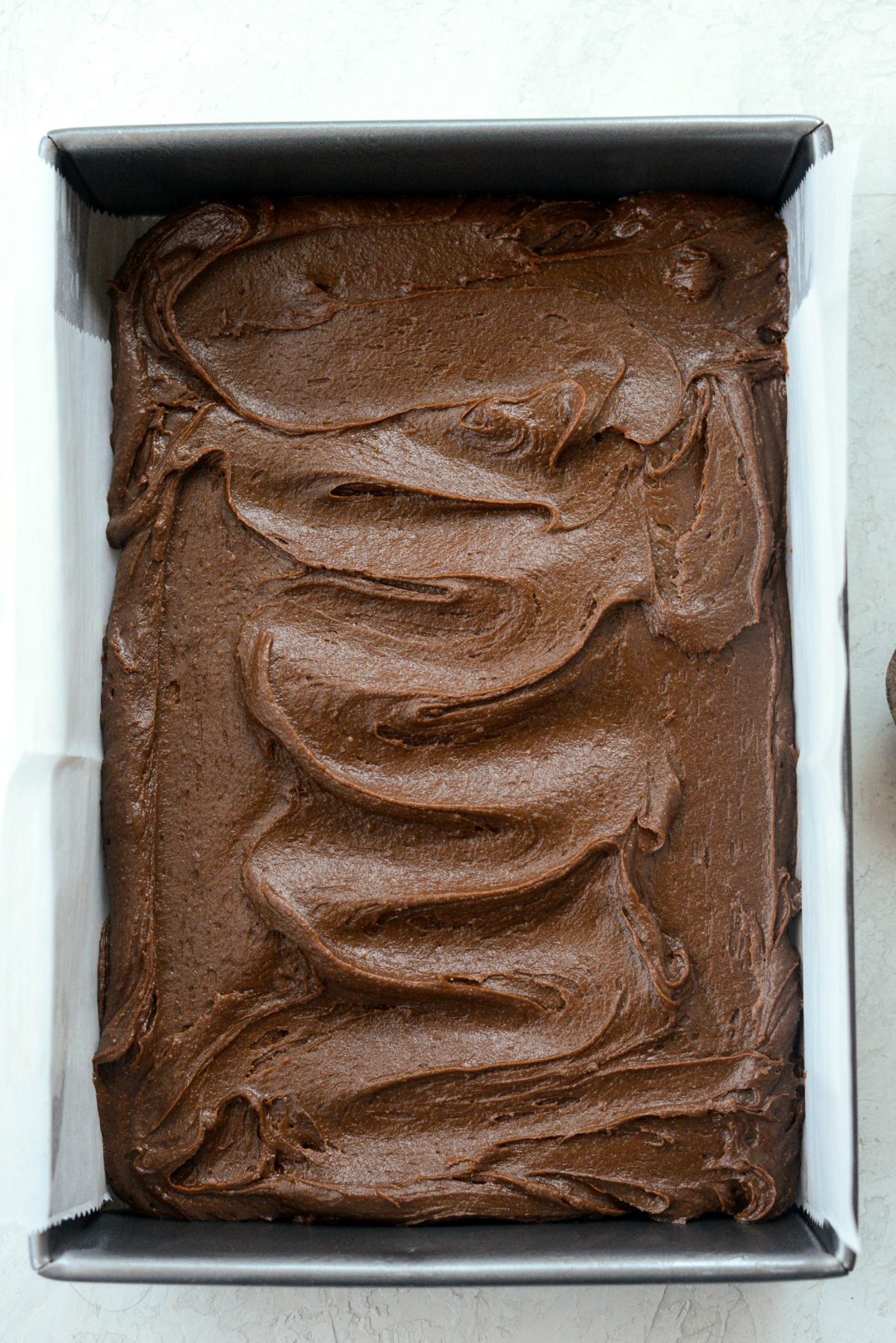 brownie batter in pan before baking