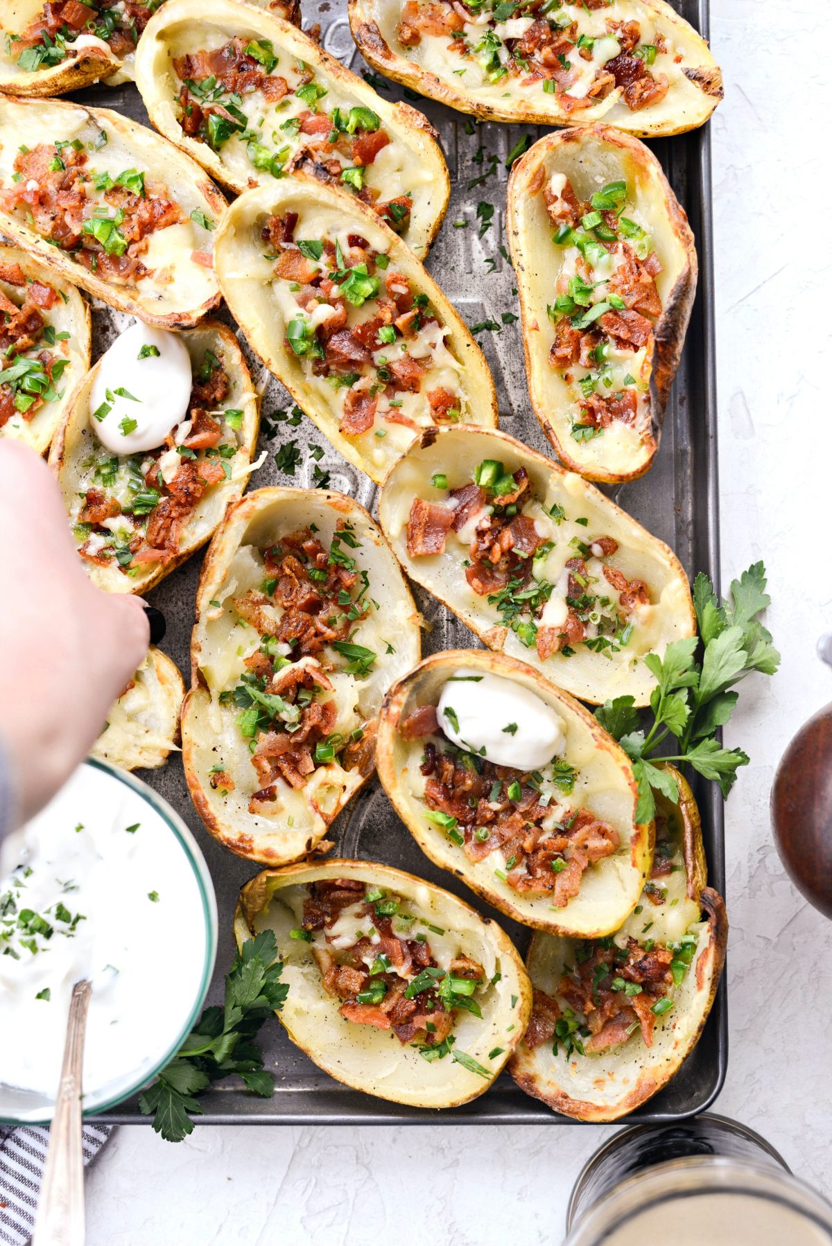 grabbing an Irish Cheddar Bacon Jalapeño Potato Skins