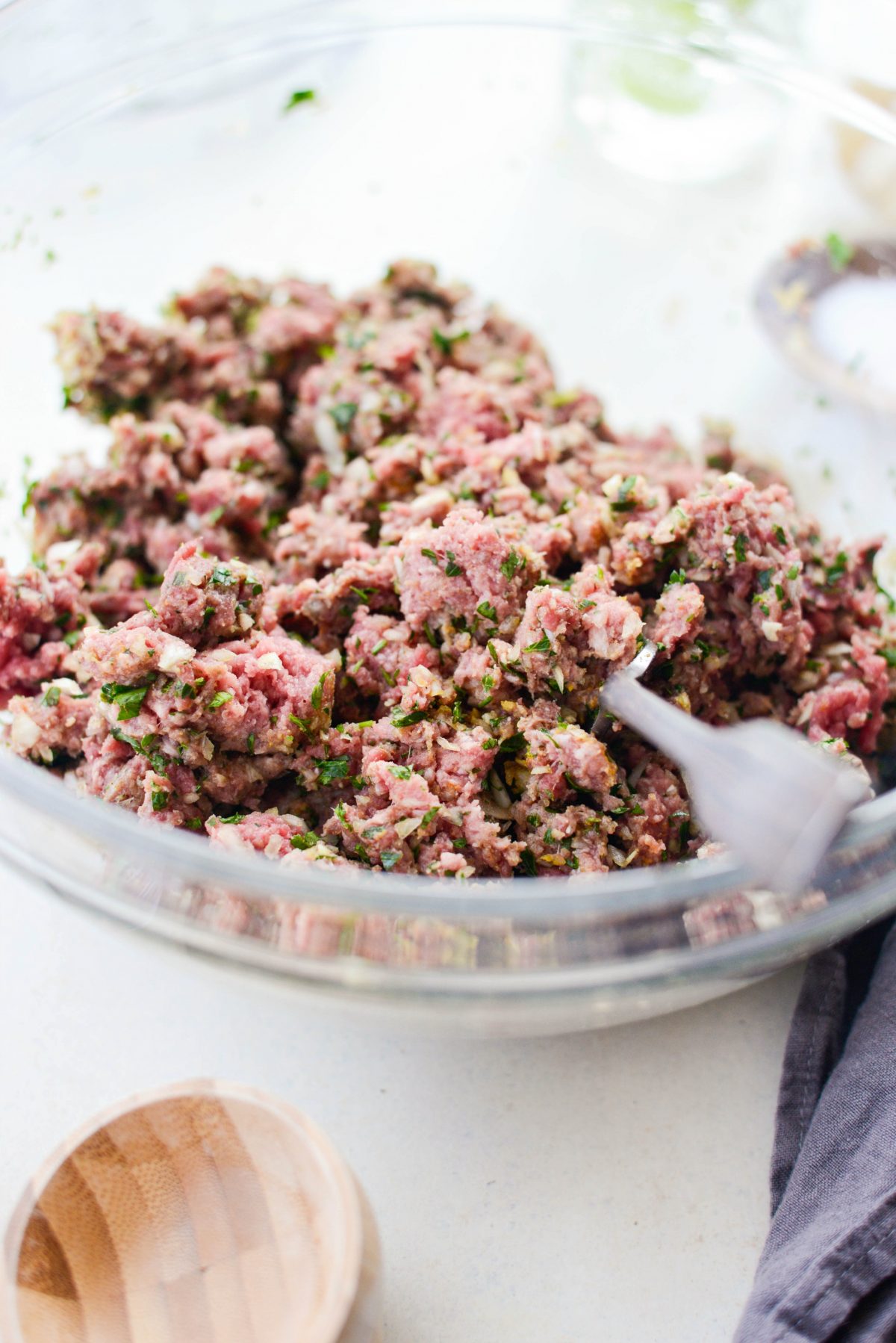 mixing meat mixture with fork