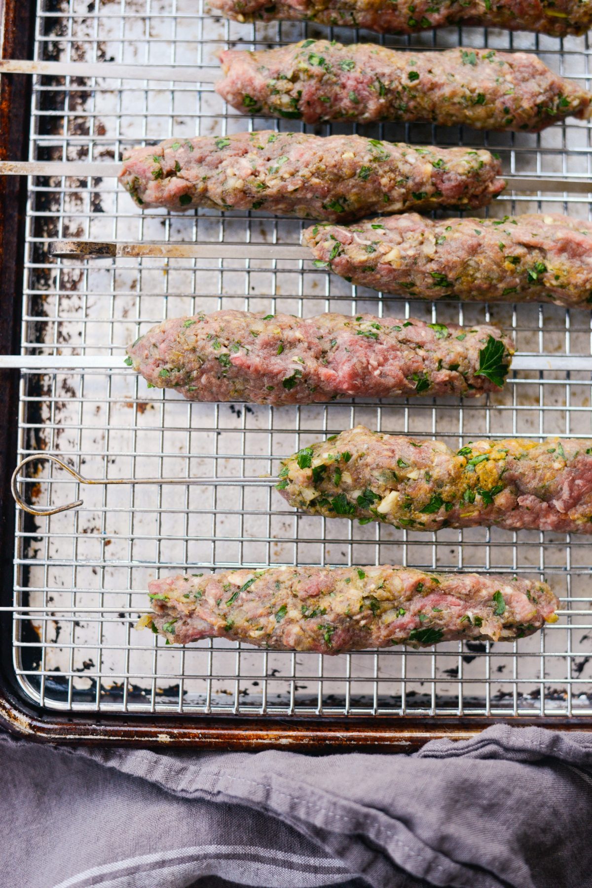 shaping meat around skewers