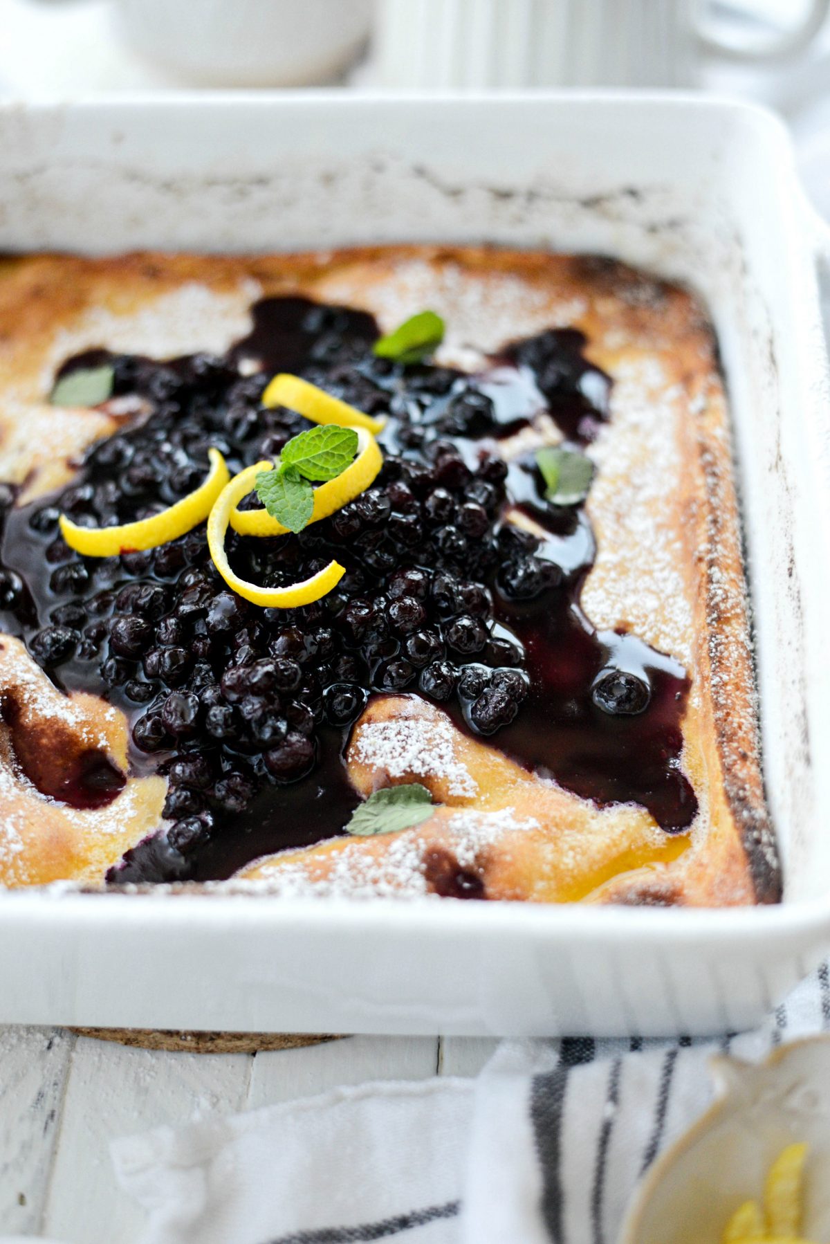 Lemon Ricotta Puff Pancake with wild blueberry syrup