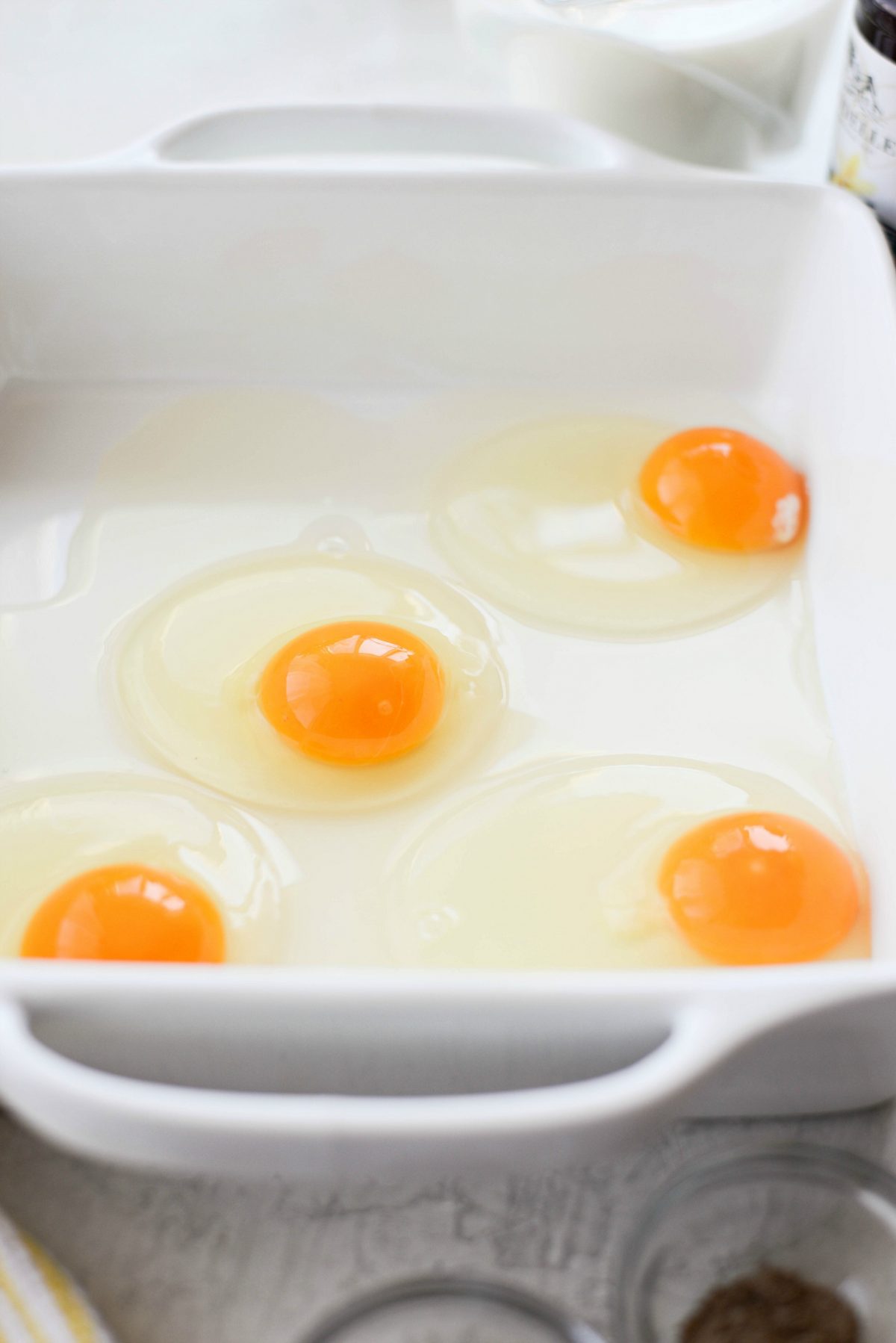crack eggs into a shallow dish