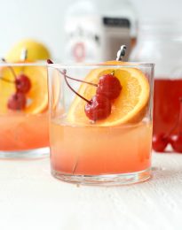 Whiskey Sour Sunrise l SimplyScratch.com #whiskey #lemon #cherry #adultbeverage #whiskeysour #recipe #drink #beverage