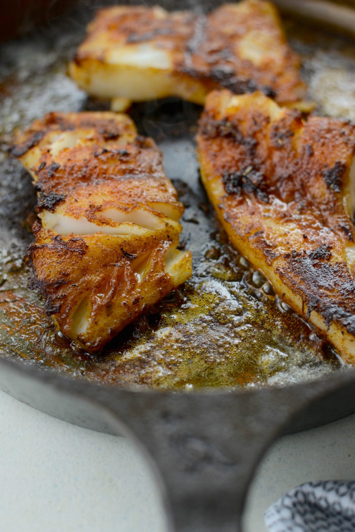 Blackened Fish in skillet.