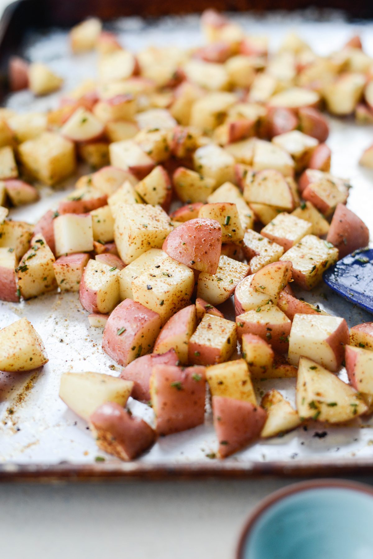 toss potatoes in seasoning and oil.