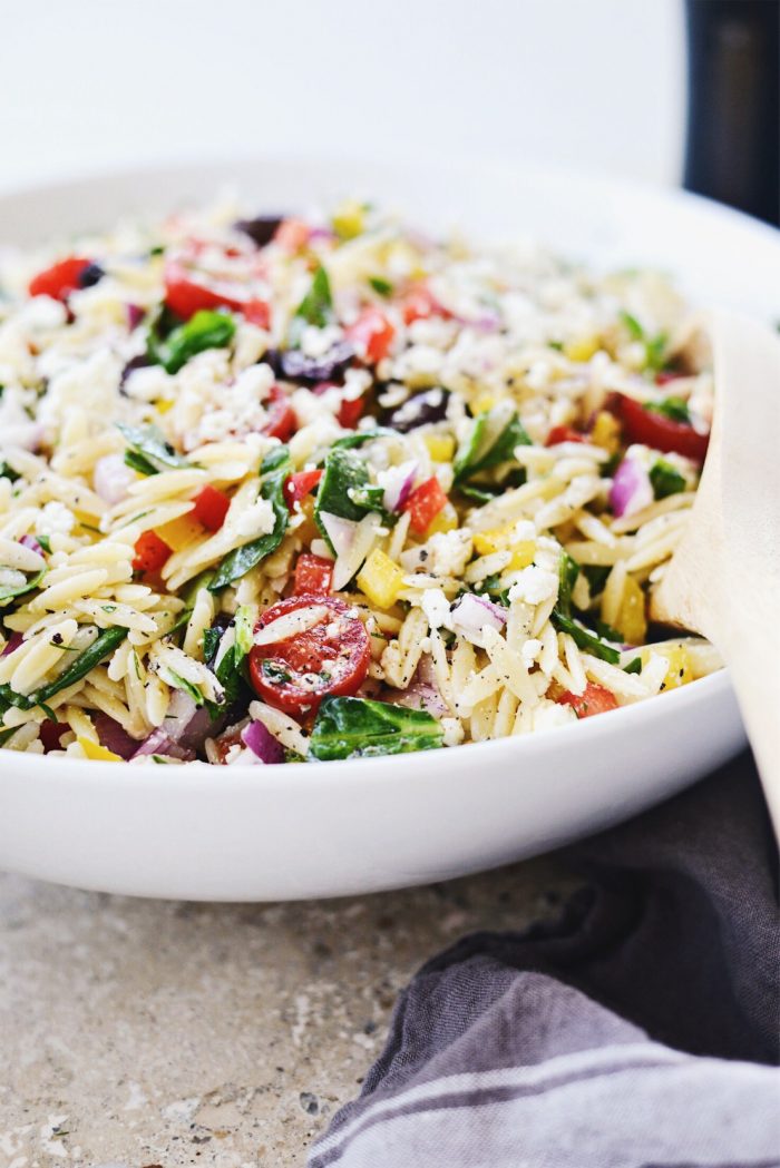 close up of Greek Orzo Salad l SimplyScratch.com #greek #orzo #pasta #salad #spinach #feta #picnic