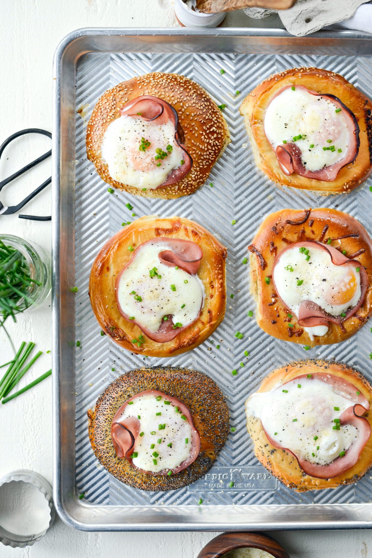Baked Egg in a Hole Bagels l SimplyScratch.com #bagels #eggs #ham #sheetpan #mothersday #breakfast #easy #recipe