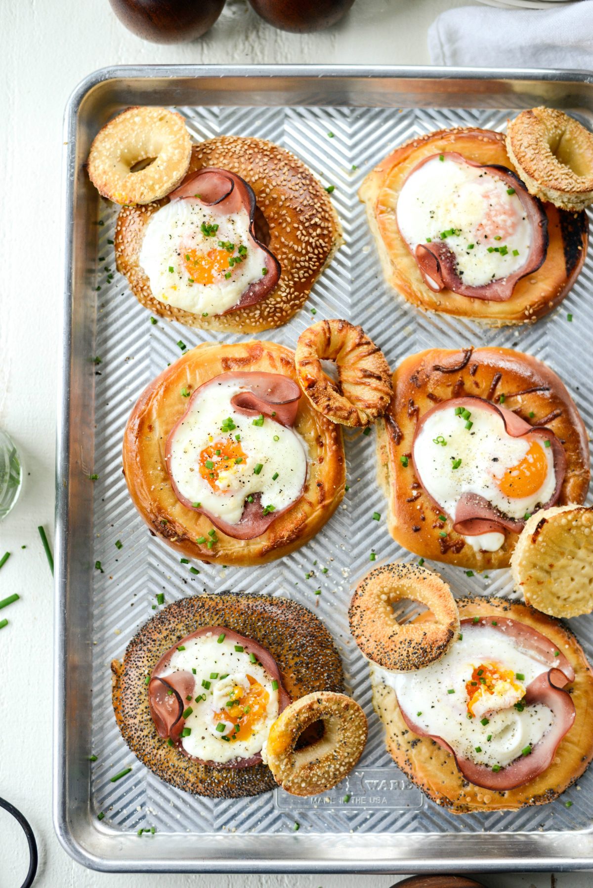 Baked Egg in a Hole Bagels l SimplyScratch.com #bagels #eggs #ham #sheetpan #mothersday #breakfast #easy #recipe
