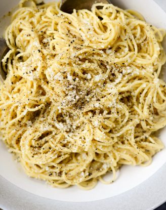 serve Cacio e Pepe Carbonara with extra cheese and freshly ground black pepper.