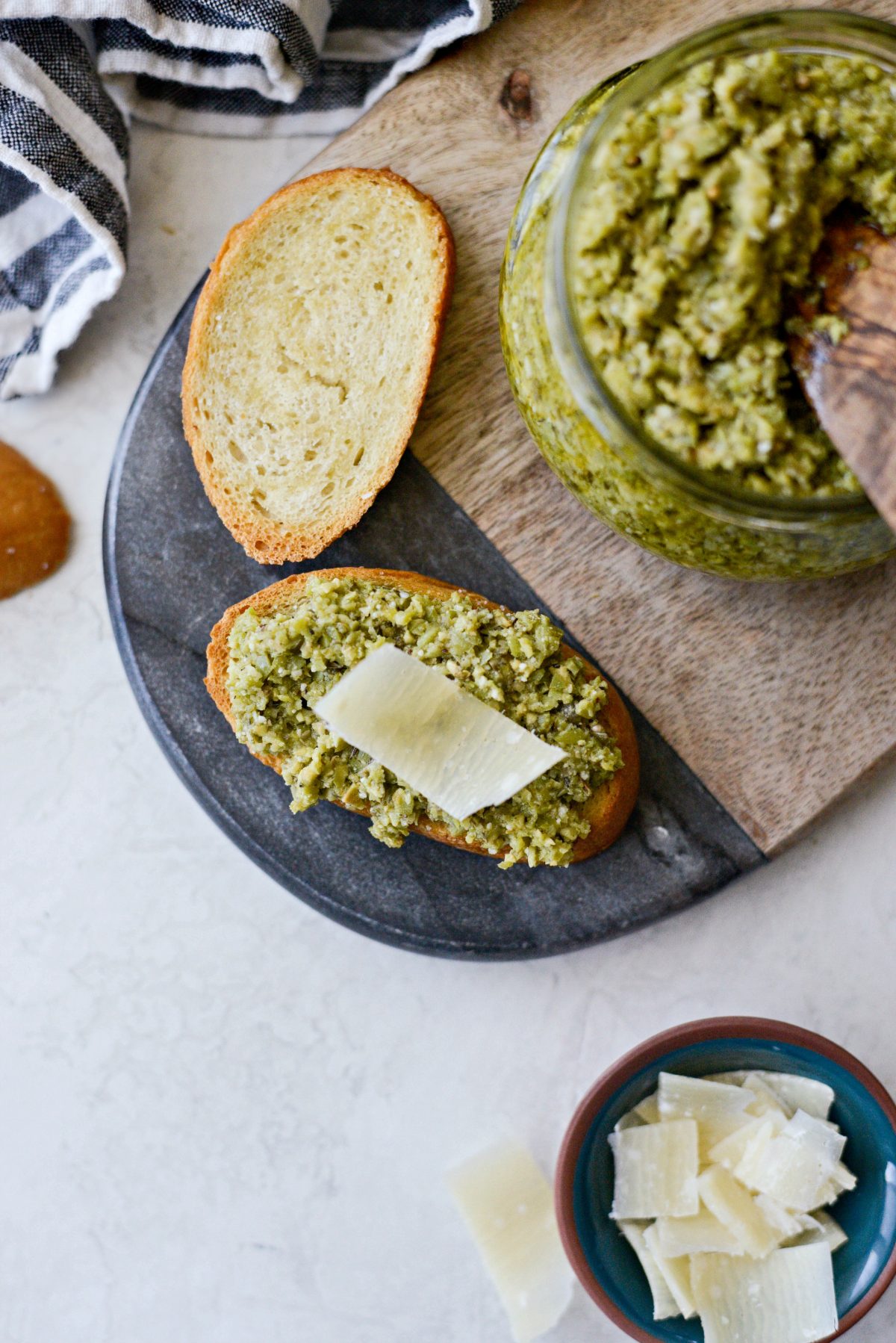 Castelvetrano Olive Tapenade on crostini with shaved parmesan