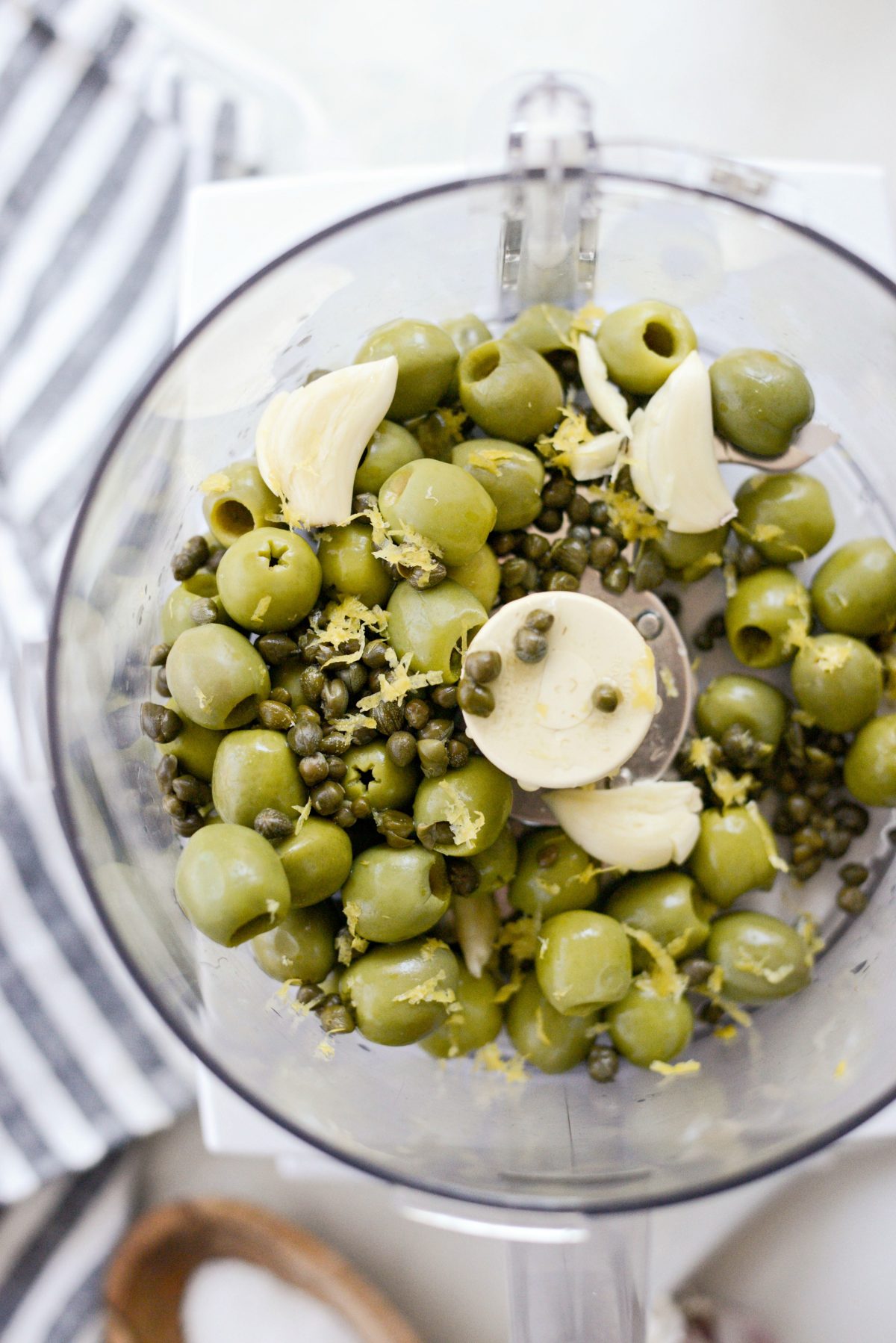olives, capers, garlic and lemon zest in food processor