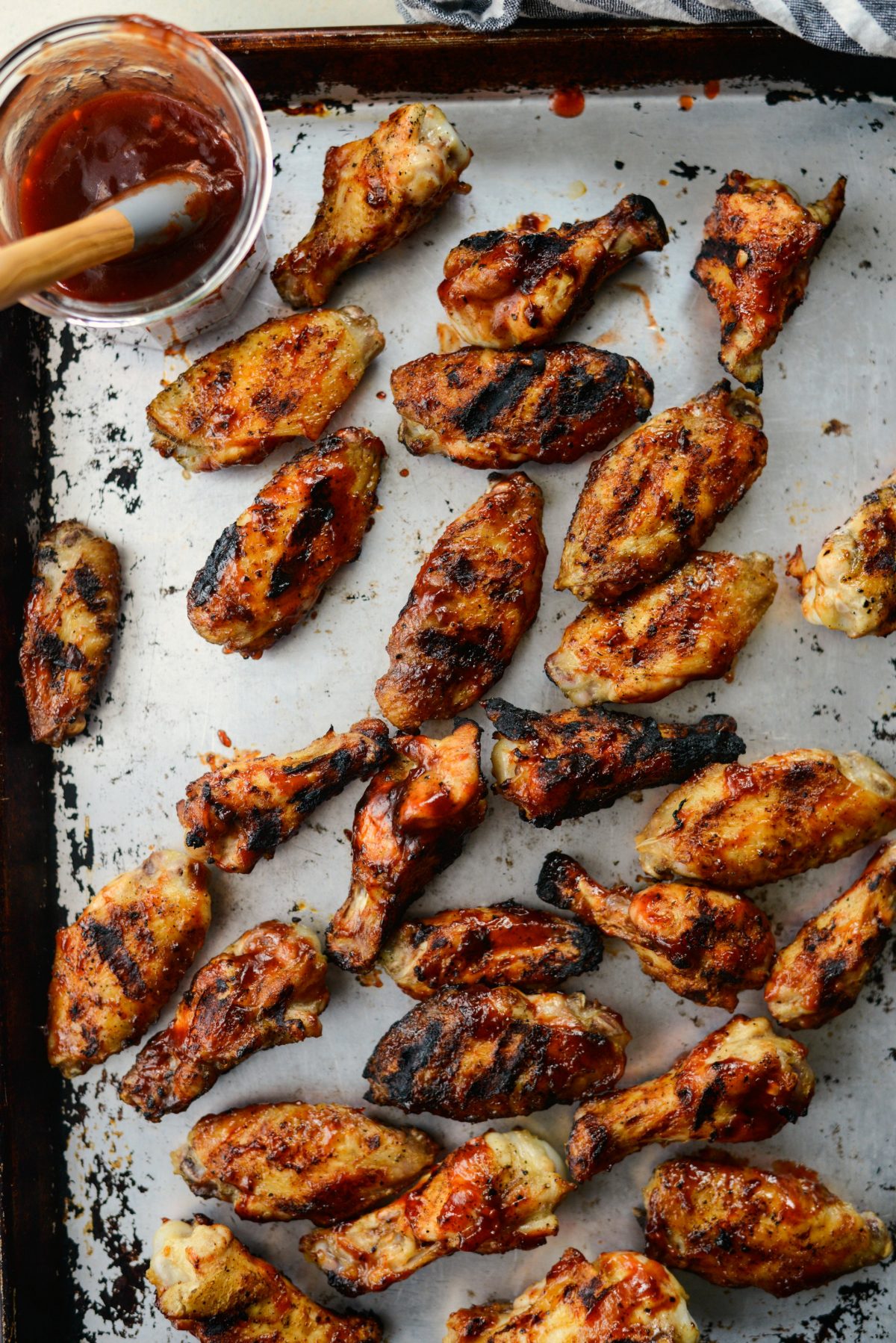 transfer cooked wings to a rimmed sheet pan.