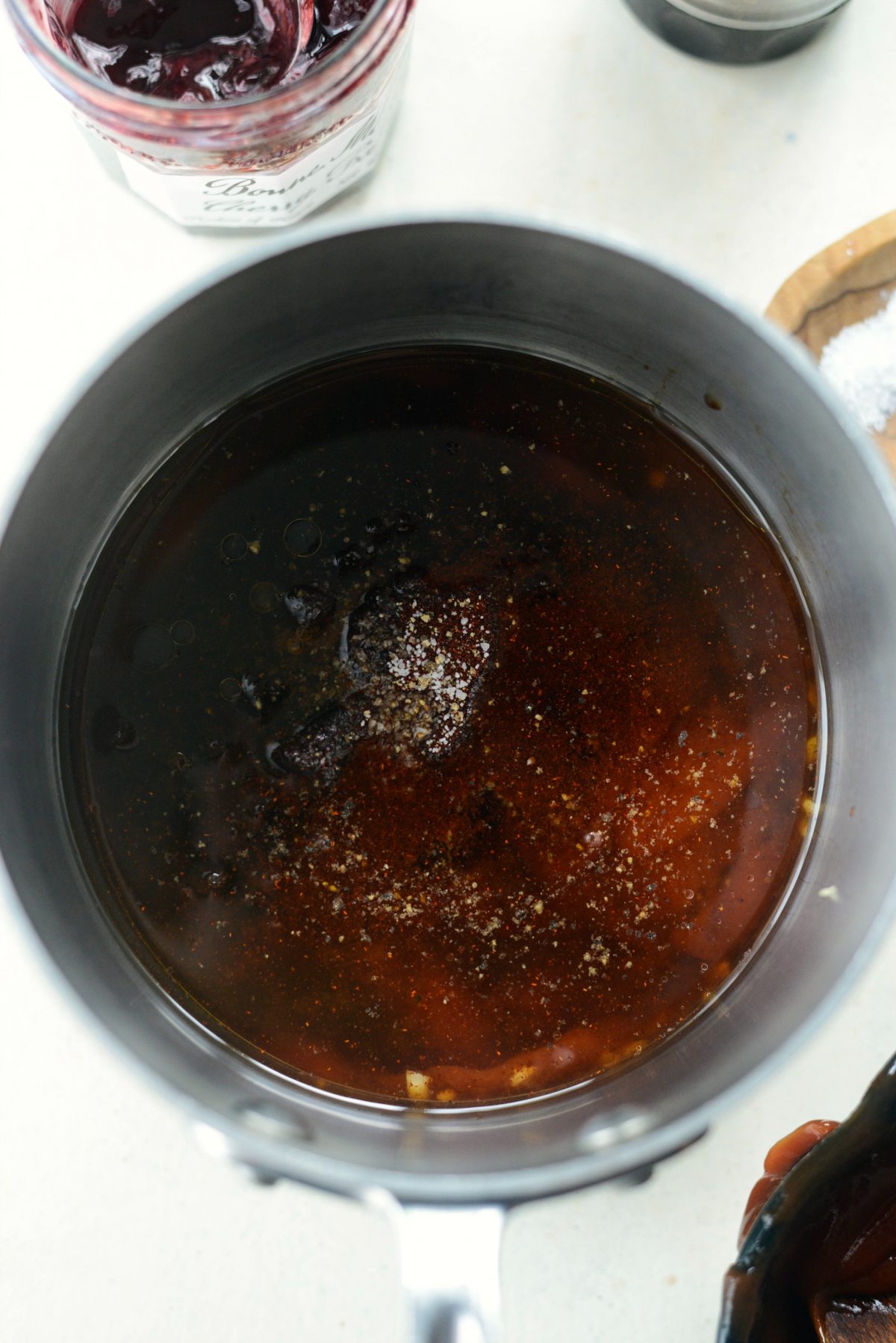 then add cherry preserves, apple cider vinegar, chipotle powder, Worcestershire sauce, salt and black pepper to taste. 