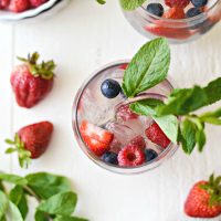 Red, White and Blue Sangria l SimplyScratch.com #adultbeverage #sangria #whitesangria #berries #wine #whitewine