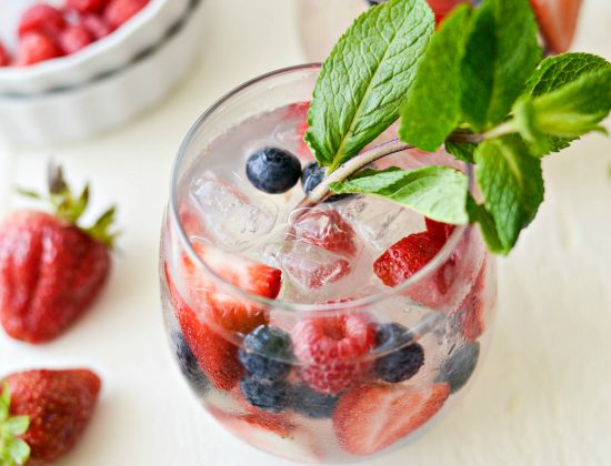 Red, White and Blue Sangria l SimplyScratch.com #adultbeverage #sangria #whitesangria #berries #wine #whitewine