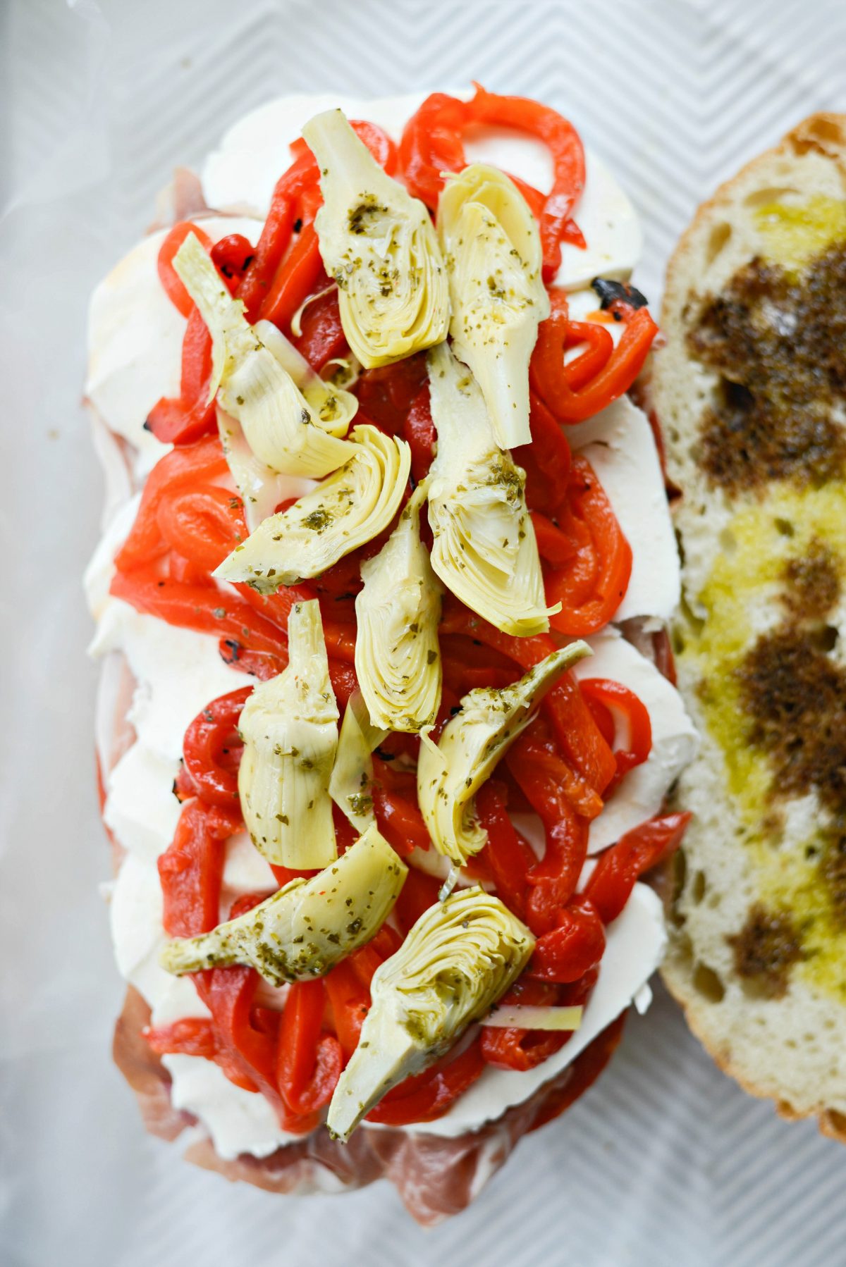 mozzarella, roasted red peppers and marinated artichokes