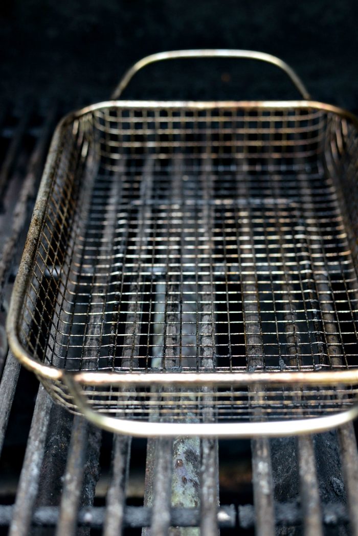 preheating grill basket on grill grates