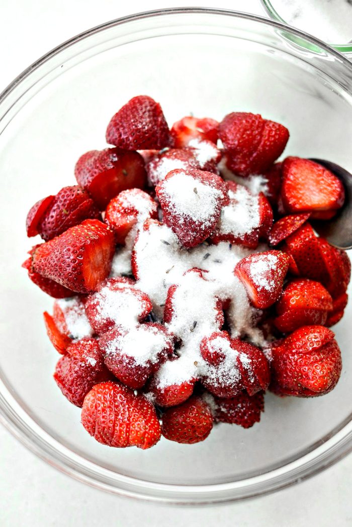 bowl of sliced strawberries and sugar