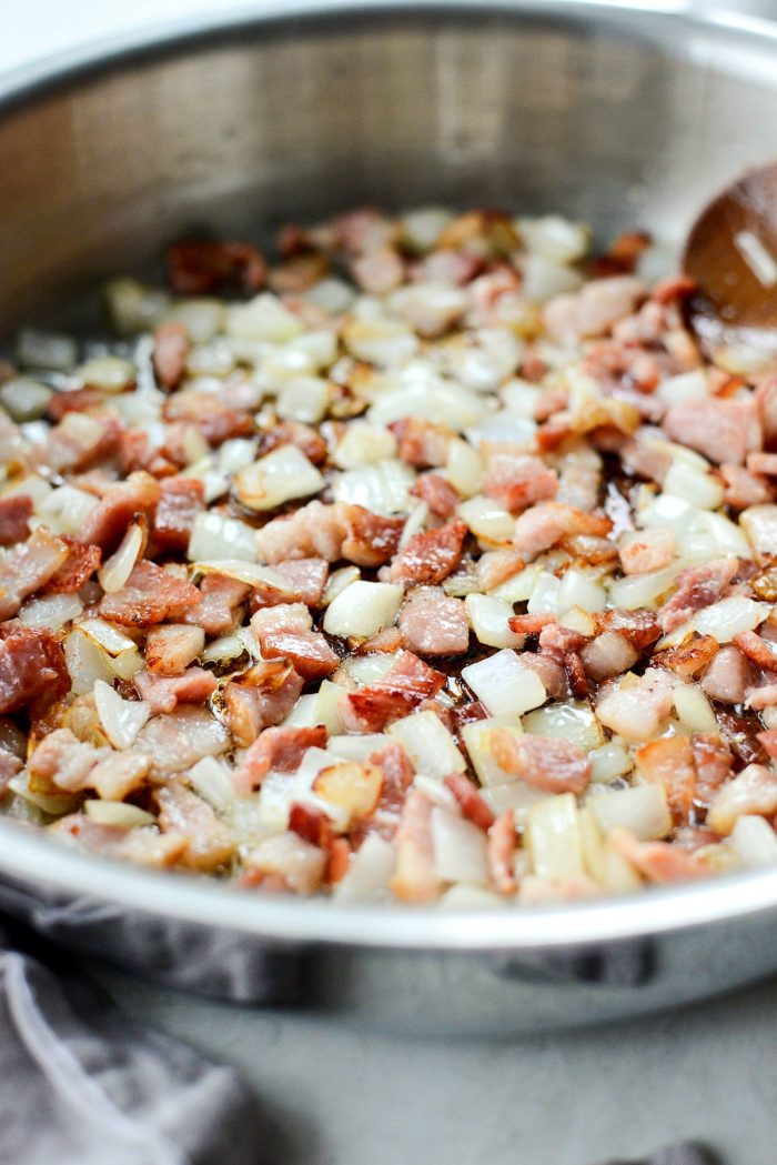 stir and cook until the bacon is crisp and the onions are soft and translucent with golden edges.