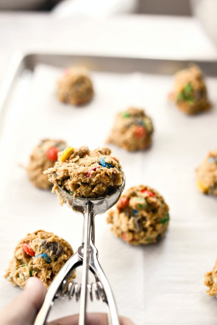 use a scoop to measure out dough onto prepared pan.