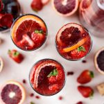 Champagne Sangria l SimplyScratch.com #champagne #sangria #valentinesday #adultbeverage #drink #alcholic #strawberry #pomegranate #raspberry