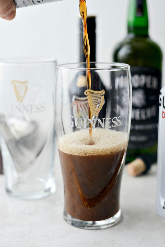 pouring Guinness into glass