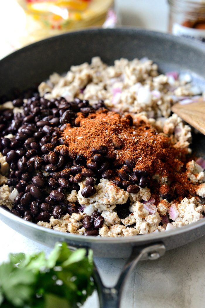 black beans and chipotle seasoning added to skillet