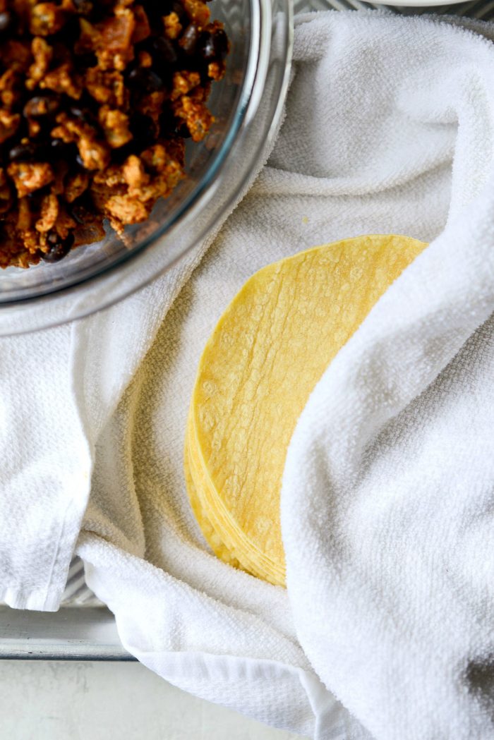 yellow corn tortillas warmed in damp towel