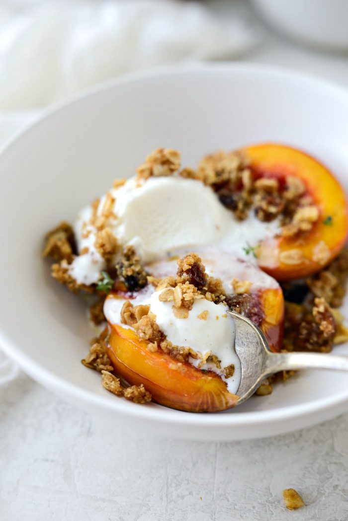 digging into Baked Nectarines with Oatmeal Cookie Crumble with a spoon