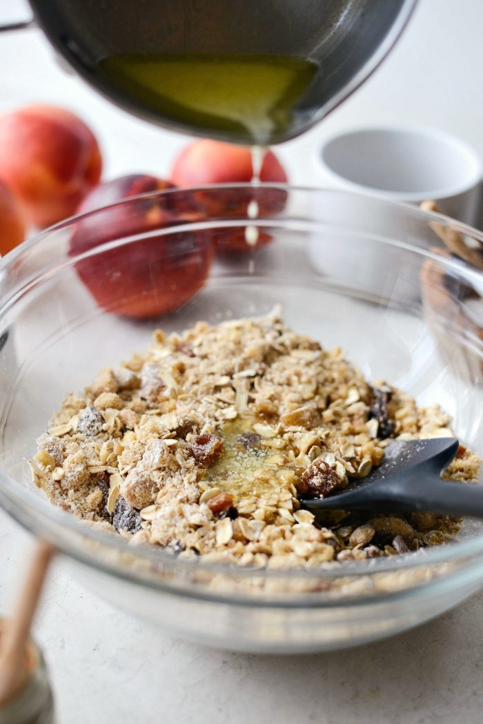 pouring butter into crumble mixture