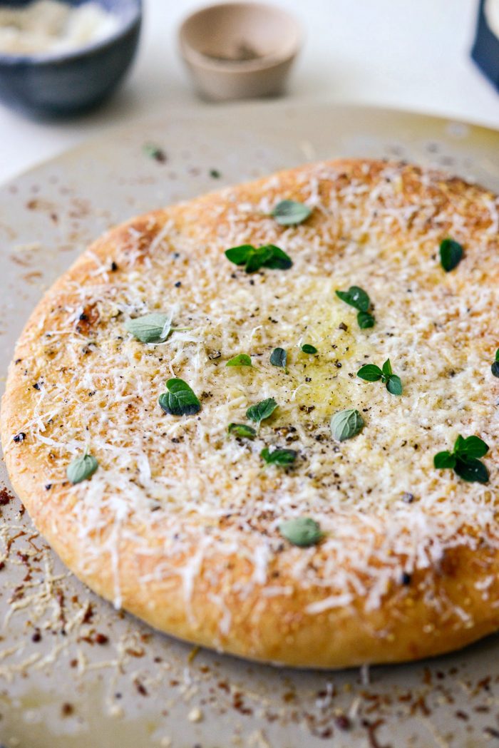 close up of pizza on pizza stone