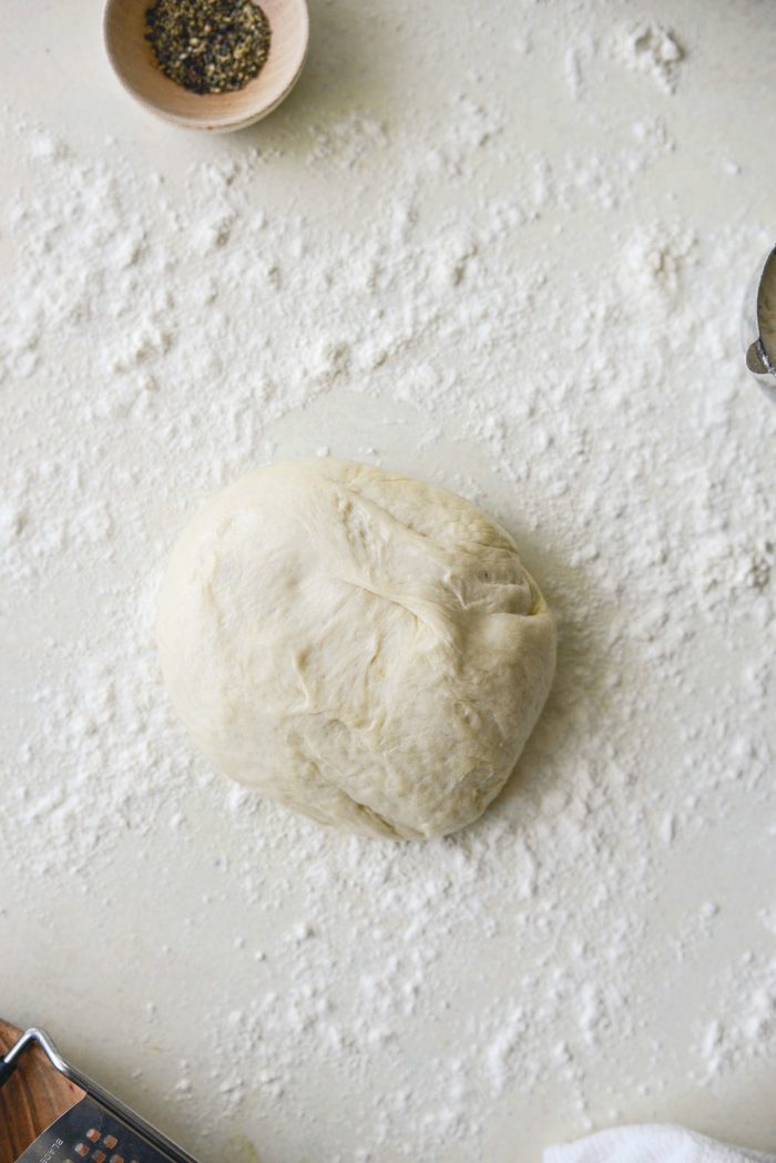 ball of dough on lightly floured surface