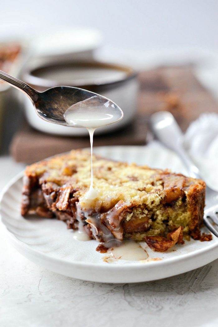 slice of dutch apple fritter bread with extra yogurt glaze