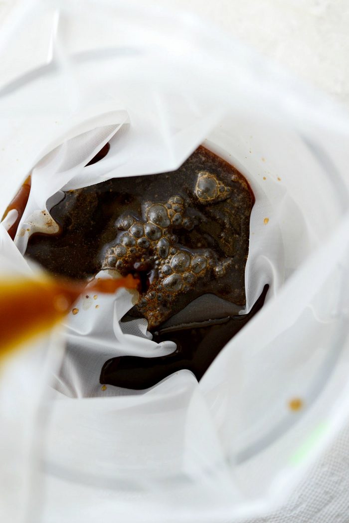 pour cold brew coffee into milk bag set into large bowl