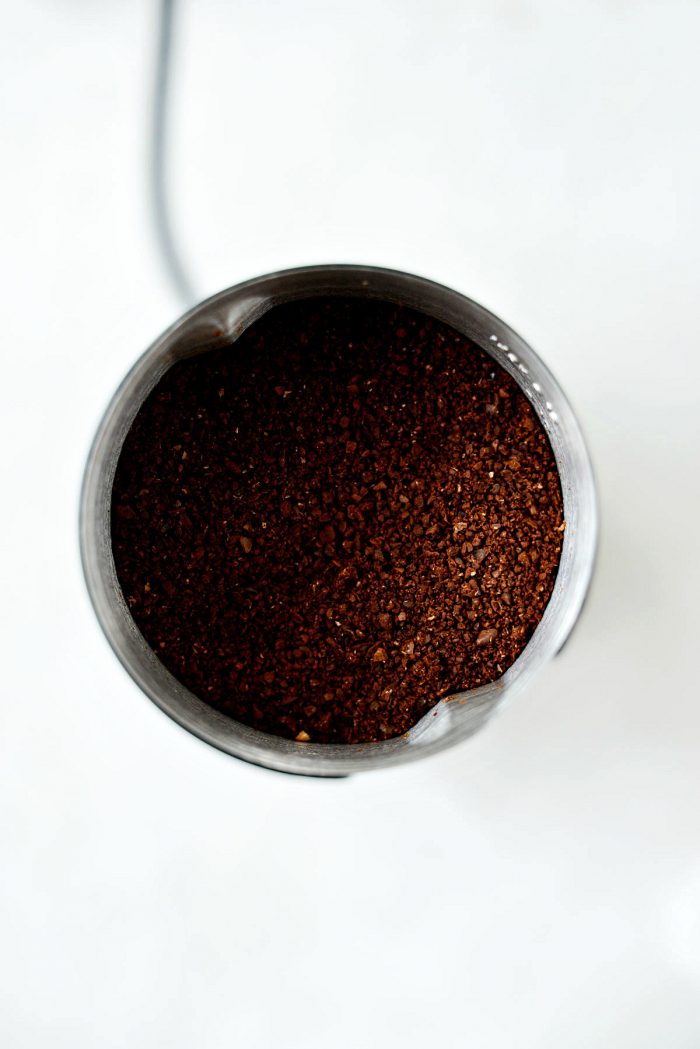 coarsely ground coffee beans in coffee grinder