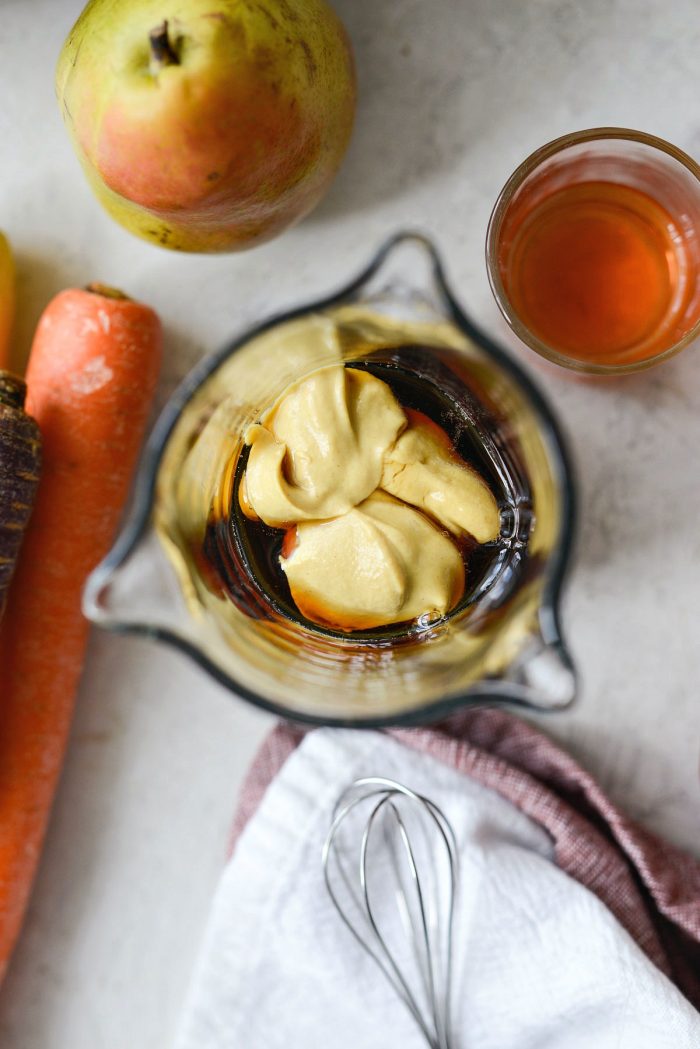 maple syrup and dijon in glass measuring cup