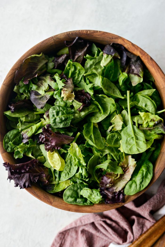 wood salad bowl with mixed salad greens